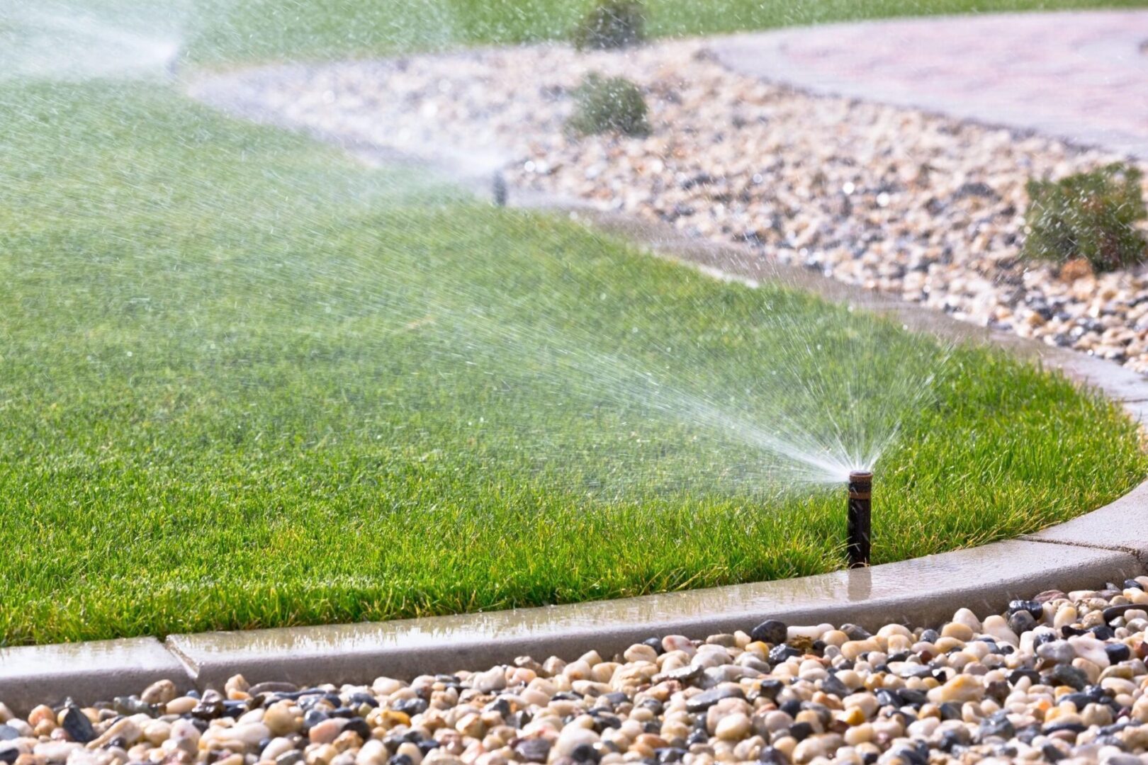 fm=f_7840.jpg_1682624513 A garden hose spraying water on the ground.